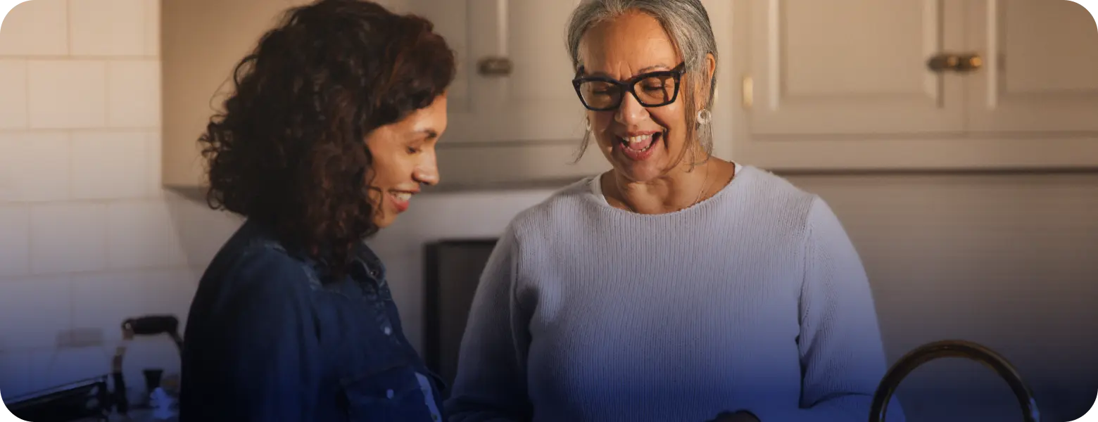 Hypothetical EKTERLY® (sebetralstat) patient speaking to a friend in an indoor setting